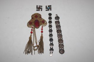 A gilt meta buckle set with red coloured stones; t