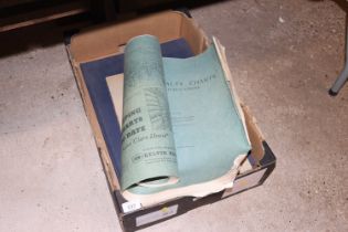 A box containing a catalogue of charts and other h