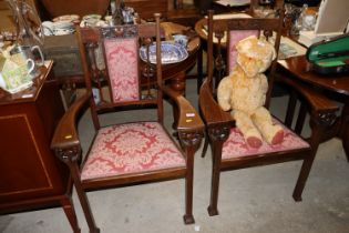 A pair of Art Nouveau decorated armchairs