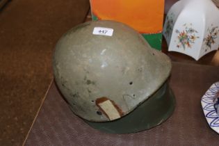 A Bosnian war steel helmet with one other helmet