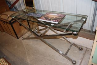 A modern design chrome finish and glass hall table