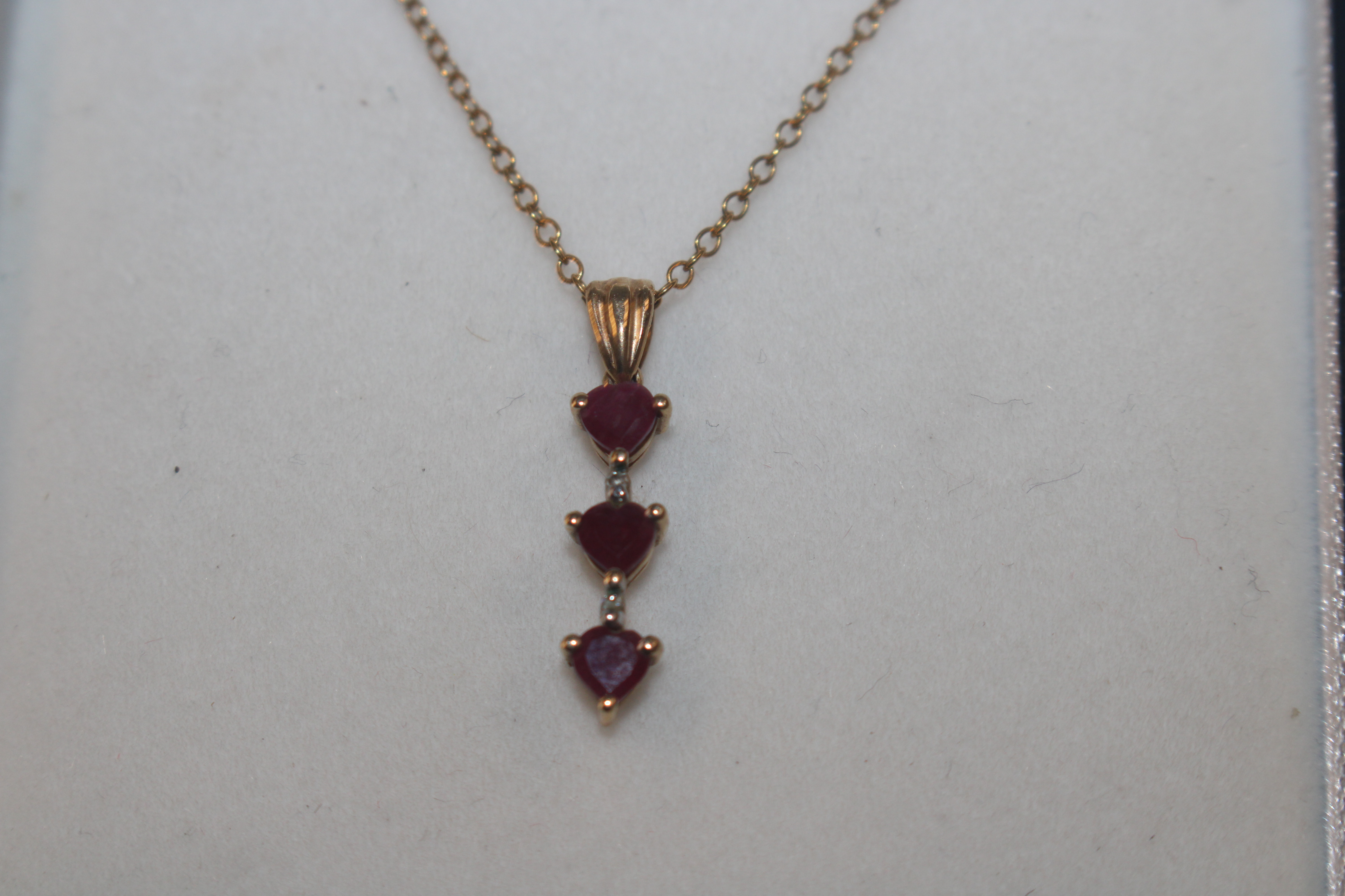 A yellow metal pendant marked 10K set with ruby co - Bild 2 aus 3