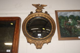 A Regency style gilt framed convex wall mirror wit