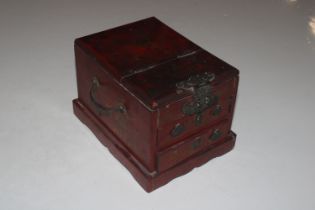 An Oriental red and gilt lacquered jewellery chest