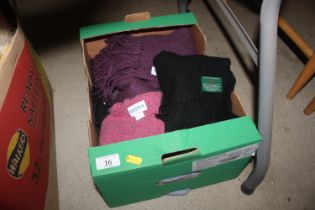 A box containing Cashmere and wool designer scarve