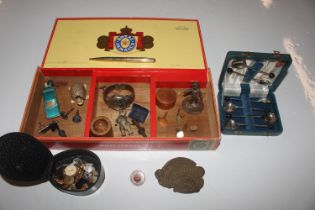 A cigar box and contents to include cuff-links, co