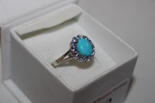 A 925 silver ring set with turquoise and tanzanite