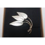 A Sterling silver and enamel leaf brooch in the st