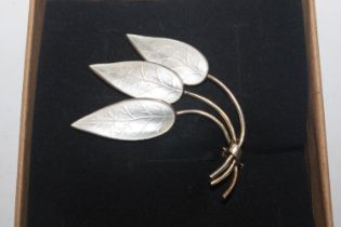 A Sterling silver and enamel leaf brooch in the st