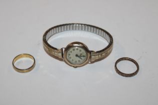 A 9ct gold cased wrist watch; an 18ct gold ring, s