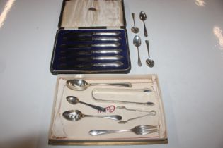 A collection of silver spoons, silver fork, two pa