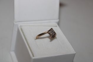 A 9ct gold ring set with chip diamonds, ring size