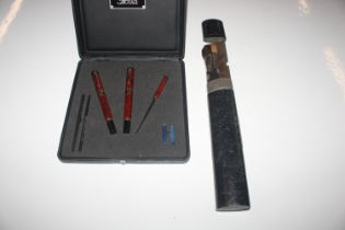 A metal artists box and a boxed Jaguar pen set