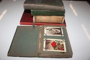 Five vintage post-card albums and contents
