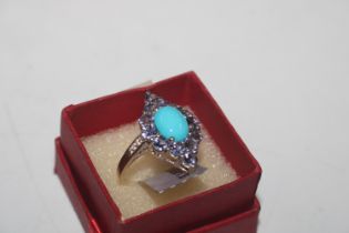 A 925 silver ring set with turquoise and tanzanite