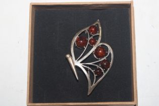 A Sterling silver and amber butterfly brooch