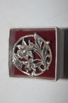 A silver Art Nouveau style daffodil brooch