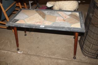 A decorative coloured marble topped coffee table r