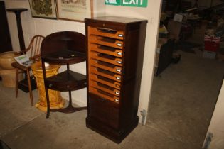 A 20th Century oak filing cabinet with tambour fro