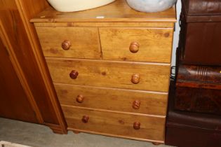 An Alstons pine chest of two short and three long drawers