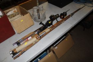 A collection of split cane and other fishing rods,