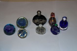 Various coloured glass paperweights; snuff bottles