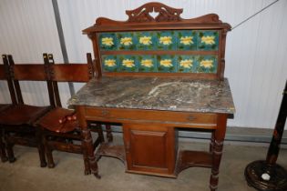 An Edwardian wash stand with Art Nouveau tiled bac