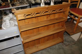 A stripped pine plate rack