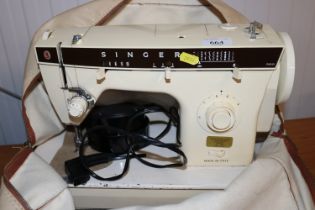 A Singer electric sewing machine, sold as collecto