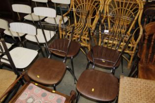 A set of four chrome and leatherette upholstered m