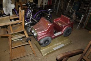 A vintage coin operated child's ride in the form o