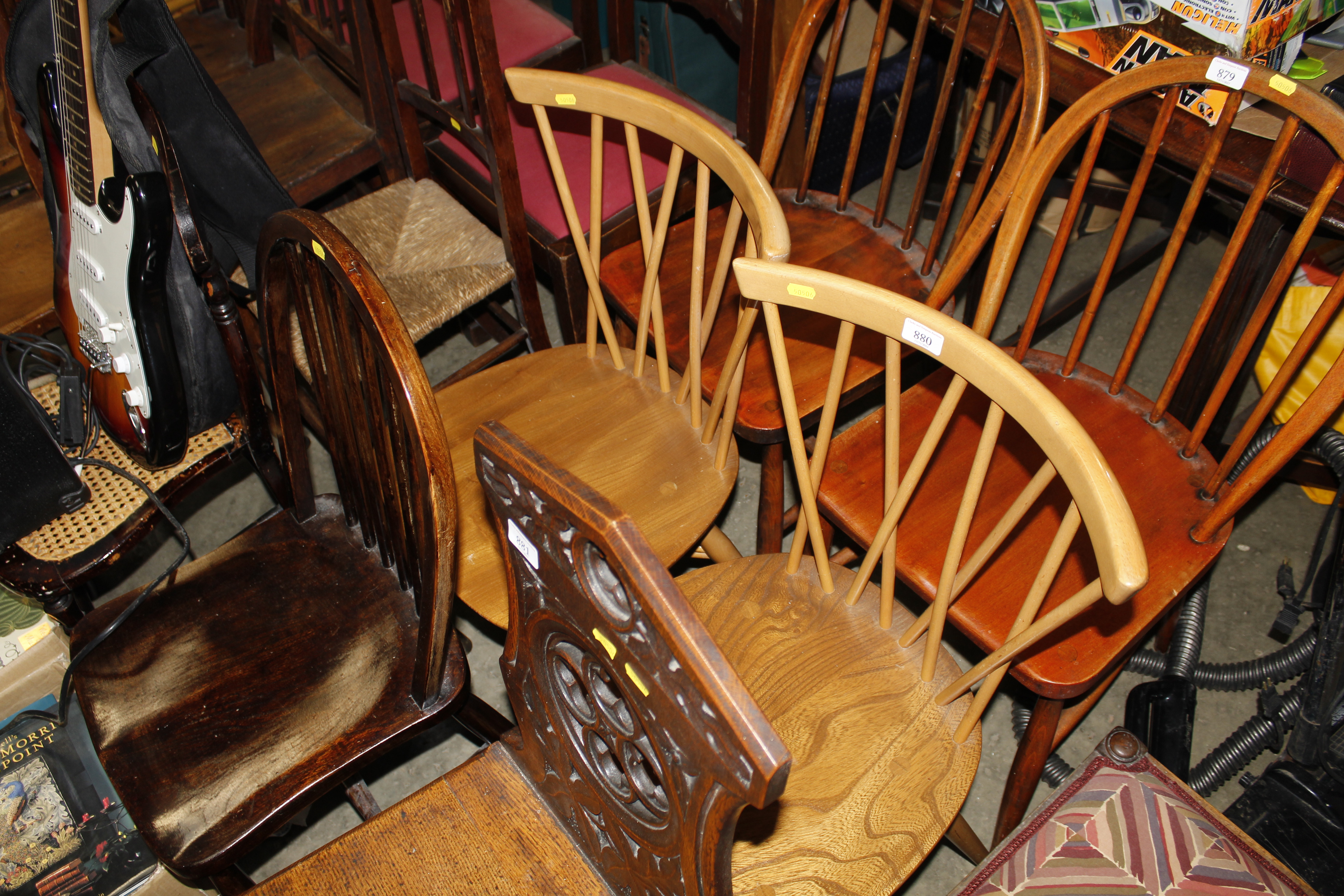 A pair of blonde Ercol stick back kitchen chairs