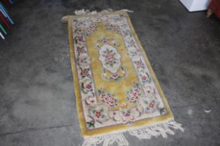 An approx. 5'7" x 2'5" Chinese rug