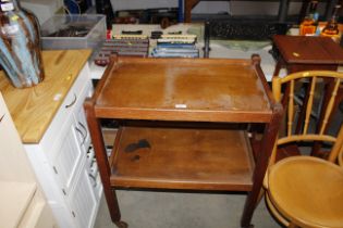 A 1930's oak two tier tea trolley