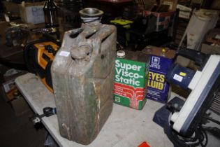 A jerry can and two oil cans