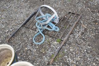 A stable door grill; a tow rope and a galvanised b