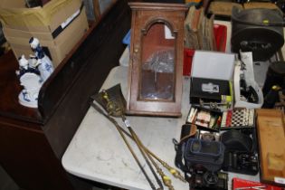 A small wooden wall mounting display cabinet and t