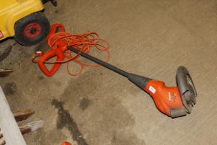 An electric Flymo strimmer