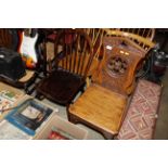 A Victorian carved oak Gothic design hall chair to