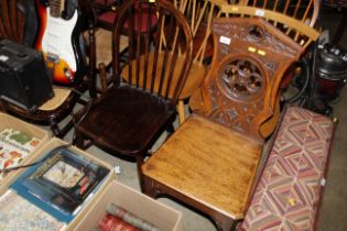 A Victorian carved oak Gothic design hall chair to