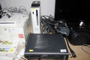 A X-Box, two X-Box 360 consoles, headphones and ac