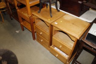 A pair of stripped pine two drawer bedside chests