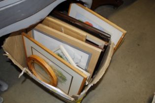 A box of miscellaneous prints, pictures and a mirr