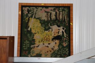 A framed wool work embroidery