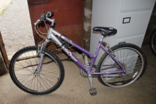 A Falcon Arizona girl's mountain bike with front s