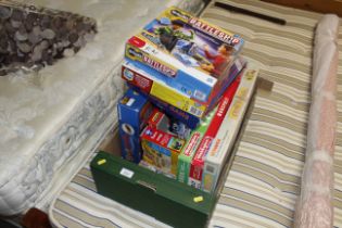 A box of various children's games including Battle