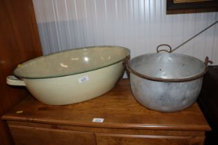 An oval enamelled wash tub and an aluminium preser