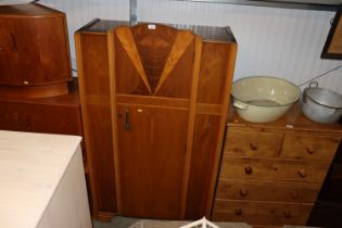 An Art Deco walnut and cross banded wardrobe