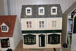 A pub and shop doll's house with furniture