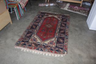 An approx. 6'5" x 4" Caucasian patterned wall rug